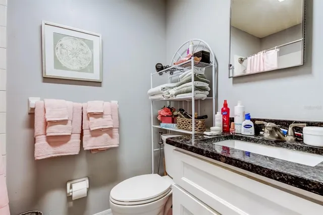 a bedroom with a bed and a chair