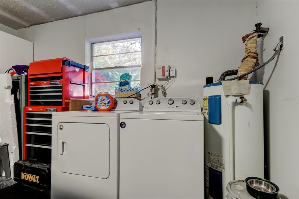 39748 Meadowood Loop Zephyrhills, FL 33542 - Photo 24 of 40 a utility room with dryer and washer