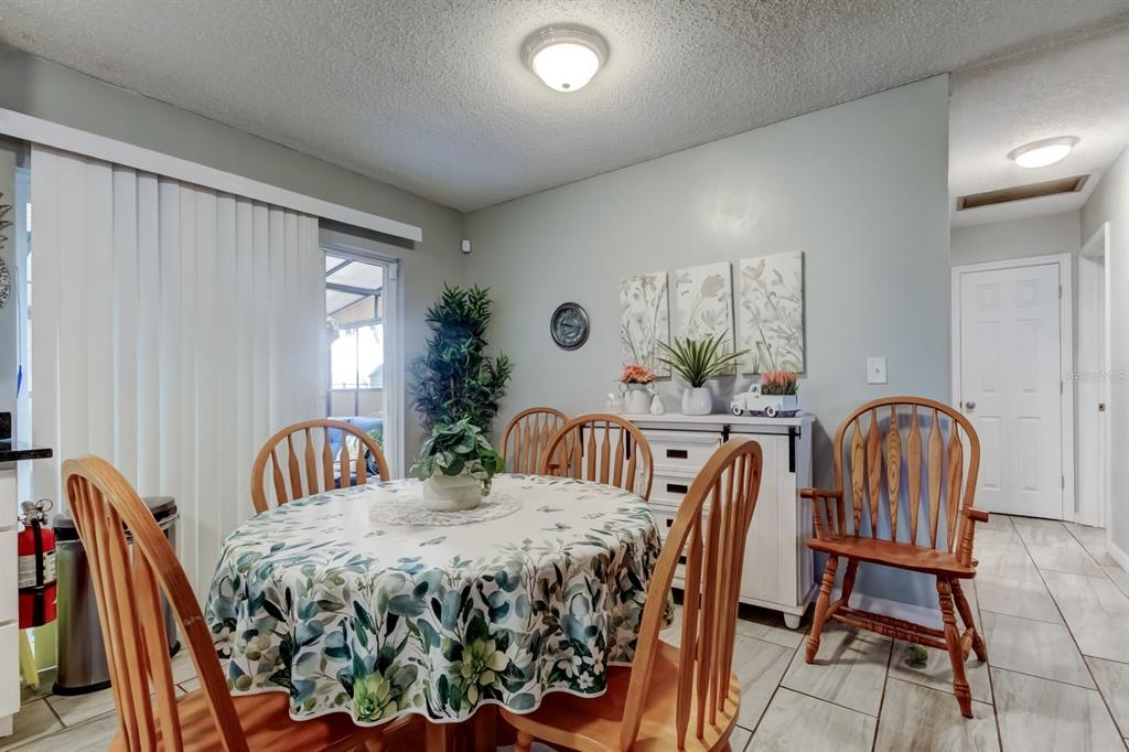 39748 Meadowood Loop Zephyrhills, FL 33542 - Photo 30 of 40 a bedroom with a bed and a chair