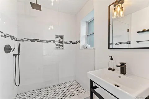 a bathroom with a sink and mirror