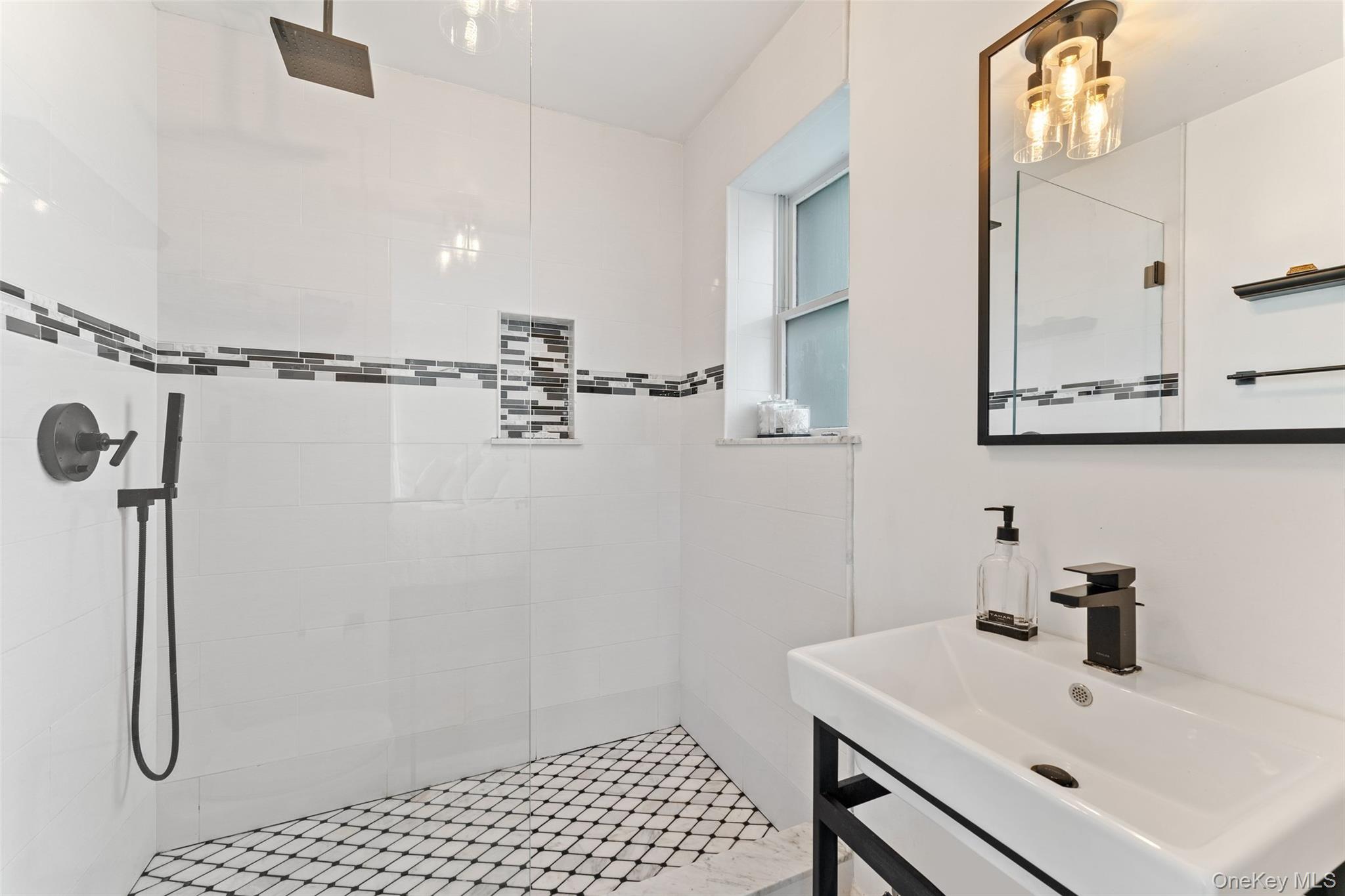 6 Hunting Ridge Road White Plains, NY 10605 - Photo 16 of 32 a bathroom with a sink and mirror