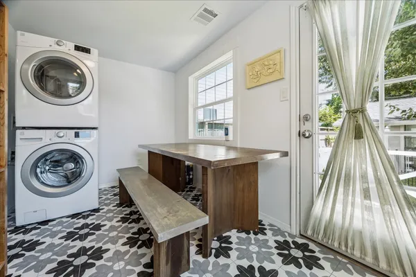 a view of a storage and utility room with washer and dryer
