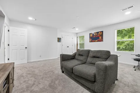 a living room with furniture and window