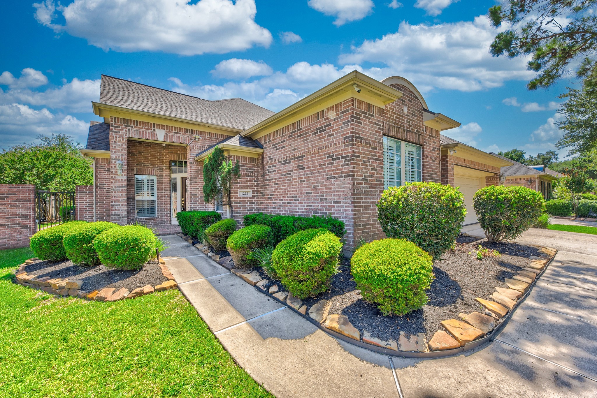 1222 Brinson Court Spring, TX 77379 - Photo 4 of 35 a front view of a house with garden
