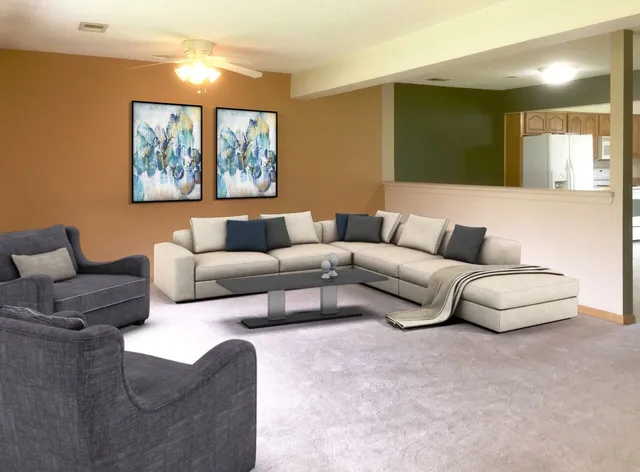 a living room with furniture and a night stand