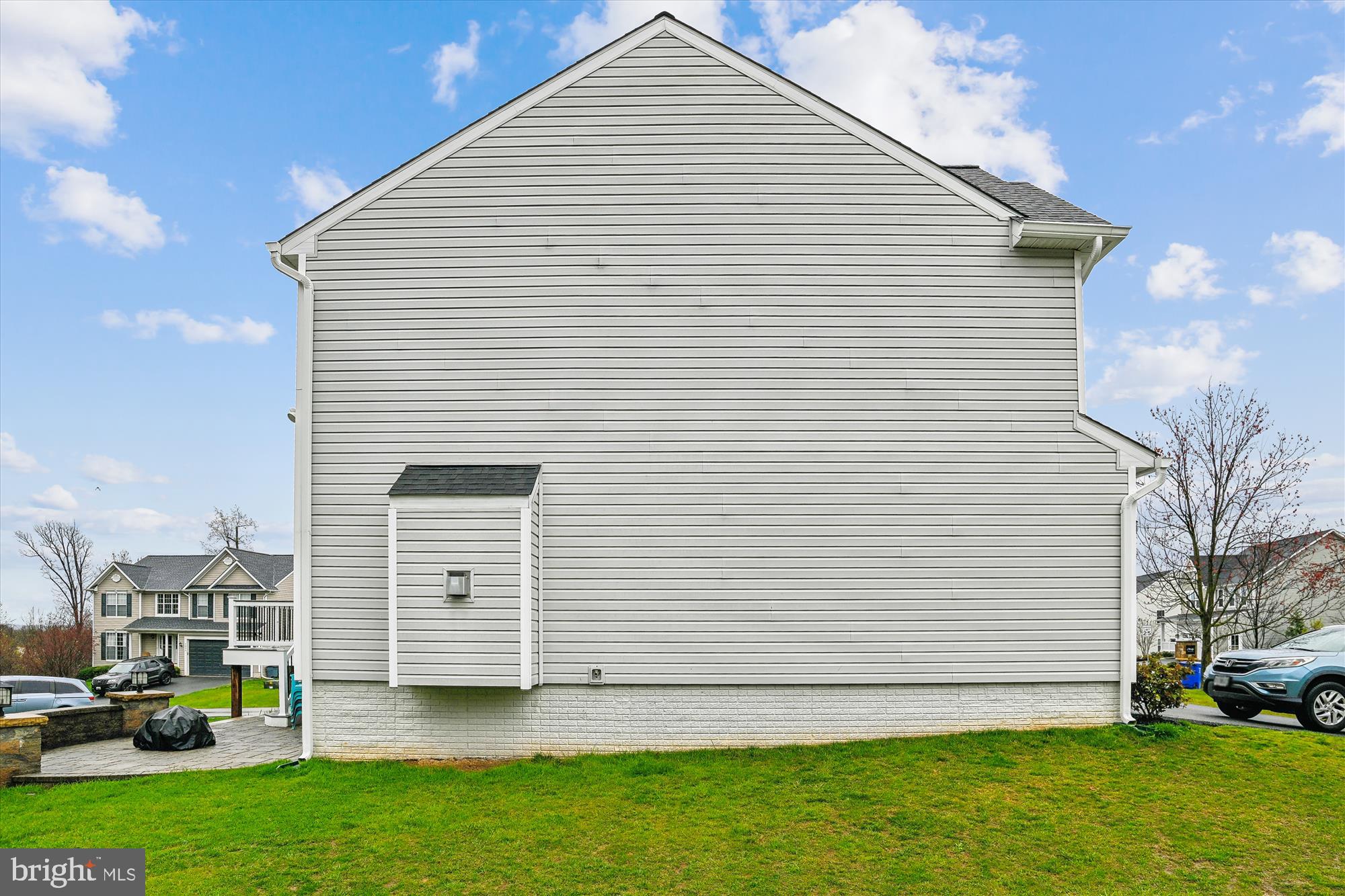 5958 Florey Road Hanover, MD 21076 - Photo 6 of 77 a view of a white house next to a yard and road