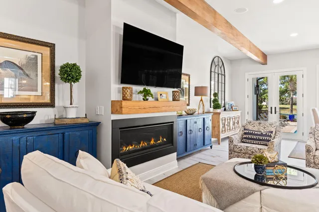 a dining room with furniture window and wooden floor
