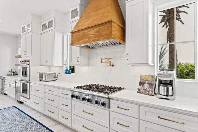 a kitchen with a sink stove and a refrigerator