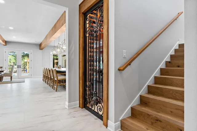 a spacious bathroom with a granite countertop sink mirror and a bathtub