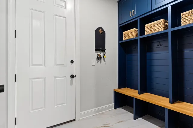 a living room with furniture a fireplace and a large window
