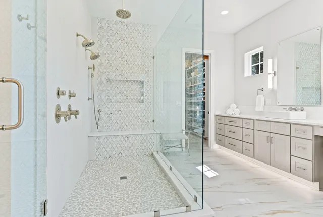 a bathroom with a tub and shower