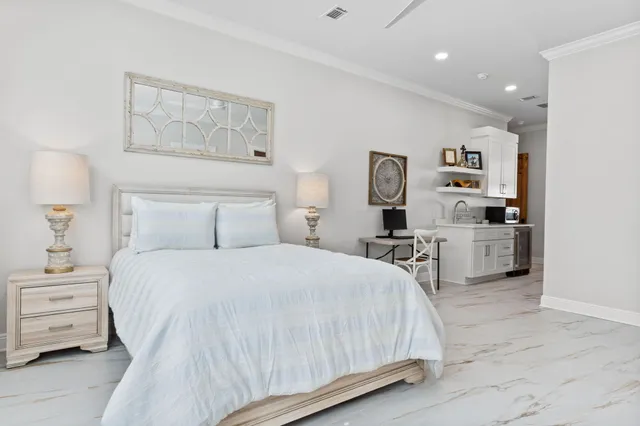 a view of swimming pool with chairs and sitting area