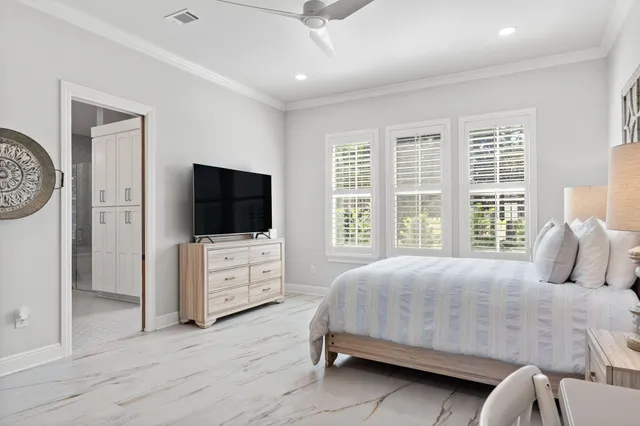 a view of a patio with table and chairs and potted plants