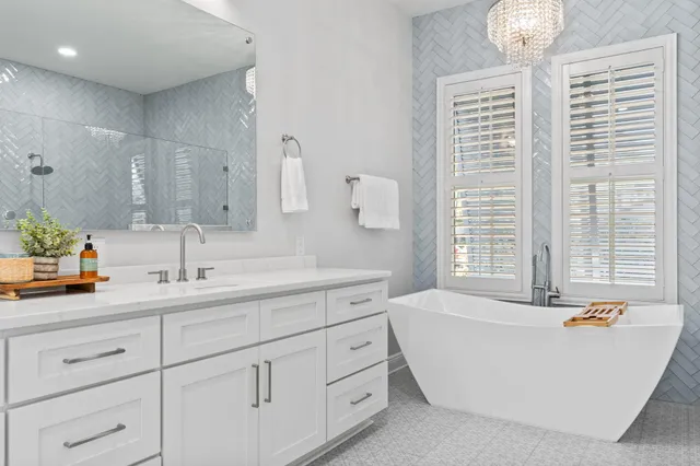 a view of a swimming pool with a patio and a yard