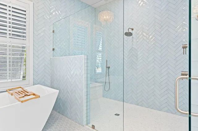 an aerial view of residential houses with outdoor space and street view