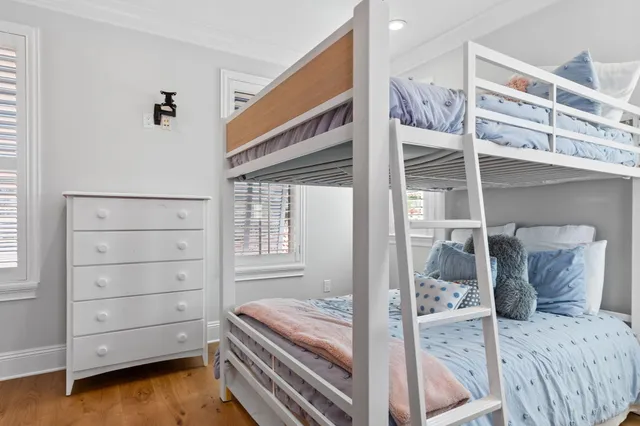 an aerial view of residential houses with outdoor space and river