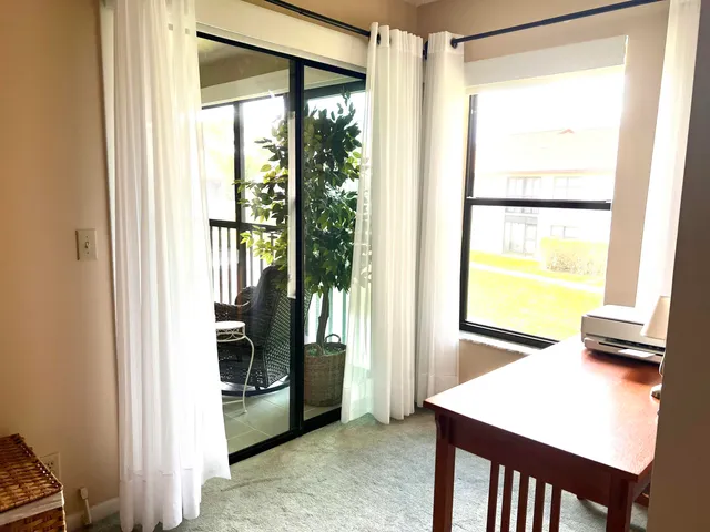 a view of a kitchen from a hallway