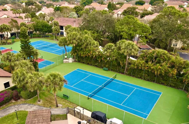 a view of an outdoor space and basketball court