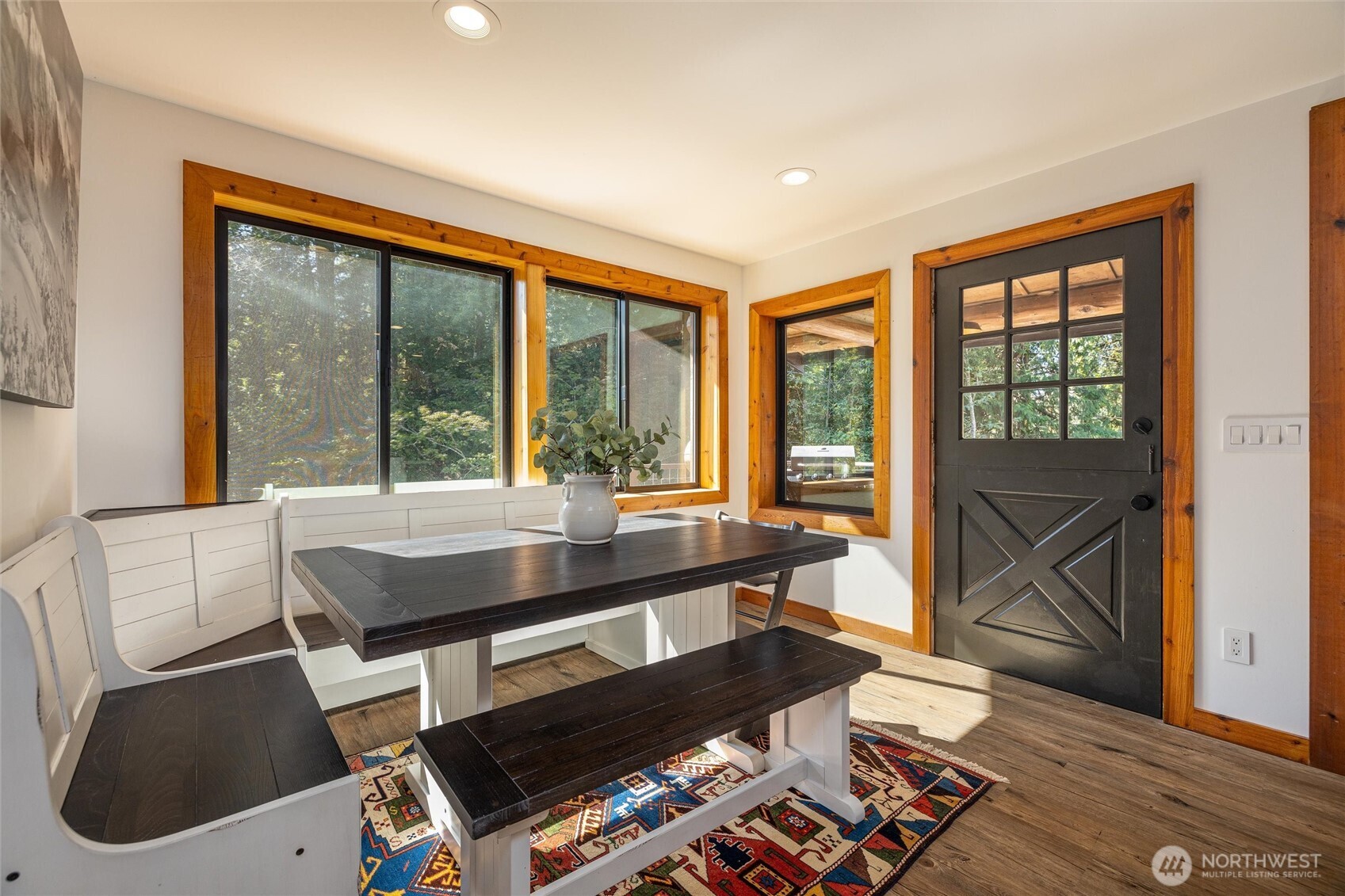 7577 Canyon View Drive Deming, WA 98244 - Photo 12 of 40 a living room with furniture and a floor to ceiling window