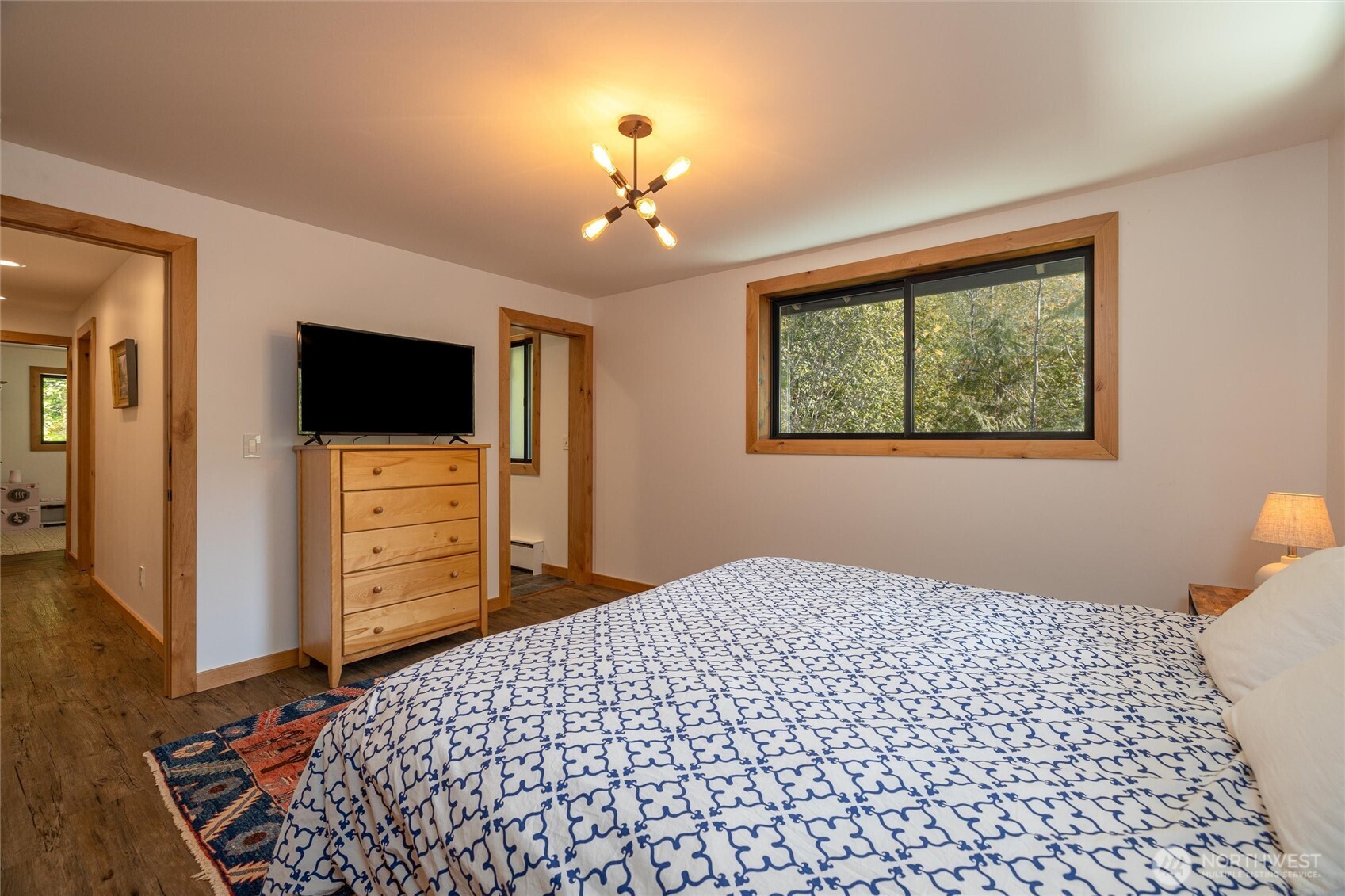 7577 Canyon View Drive Deming, WA 98244 - Photo 20 of 40 a bedroom with a bed and a flat screen tv