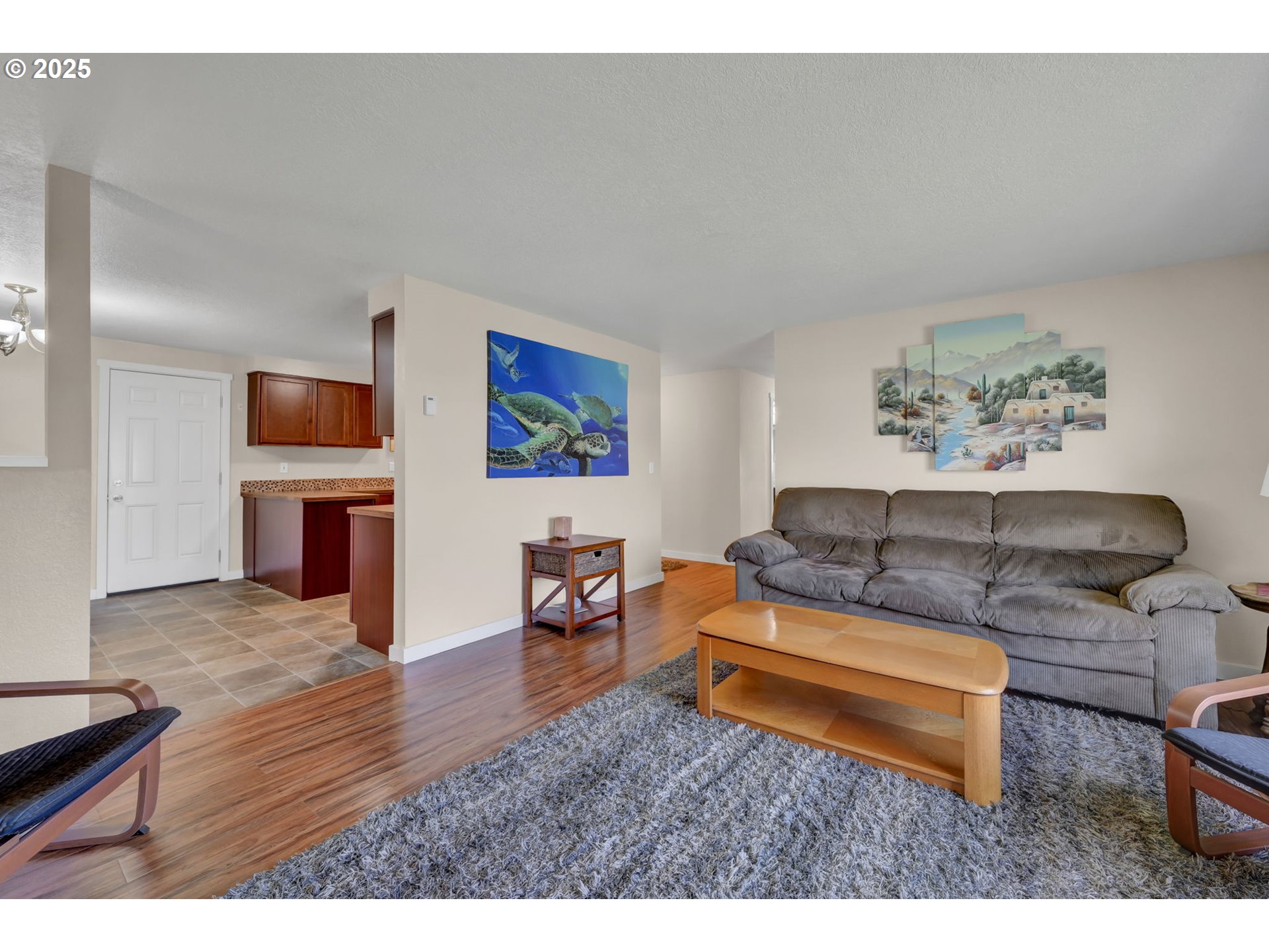 468 North 55th Street Springfield, OR 97478 - Photo 8 of 40 a living room with furniture and a flat screen tv