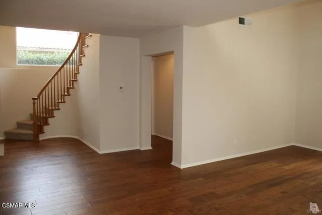 a view of an entryway with wooden floor