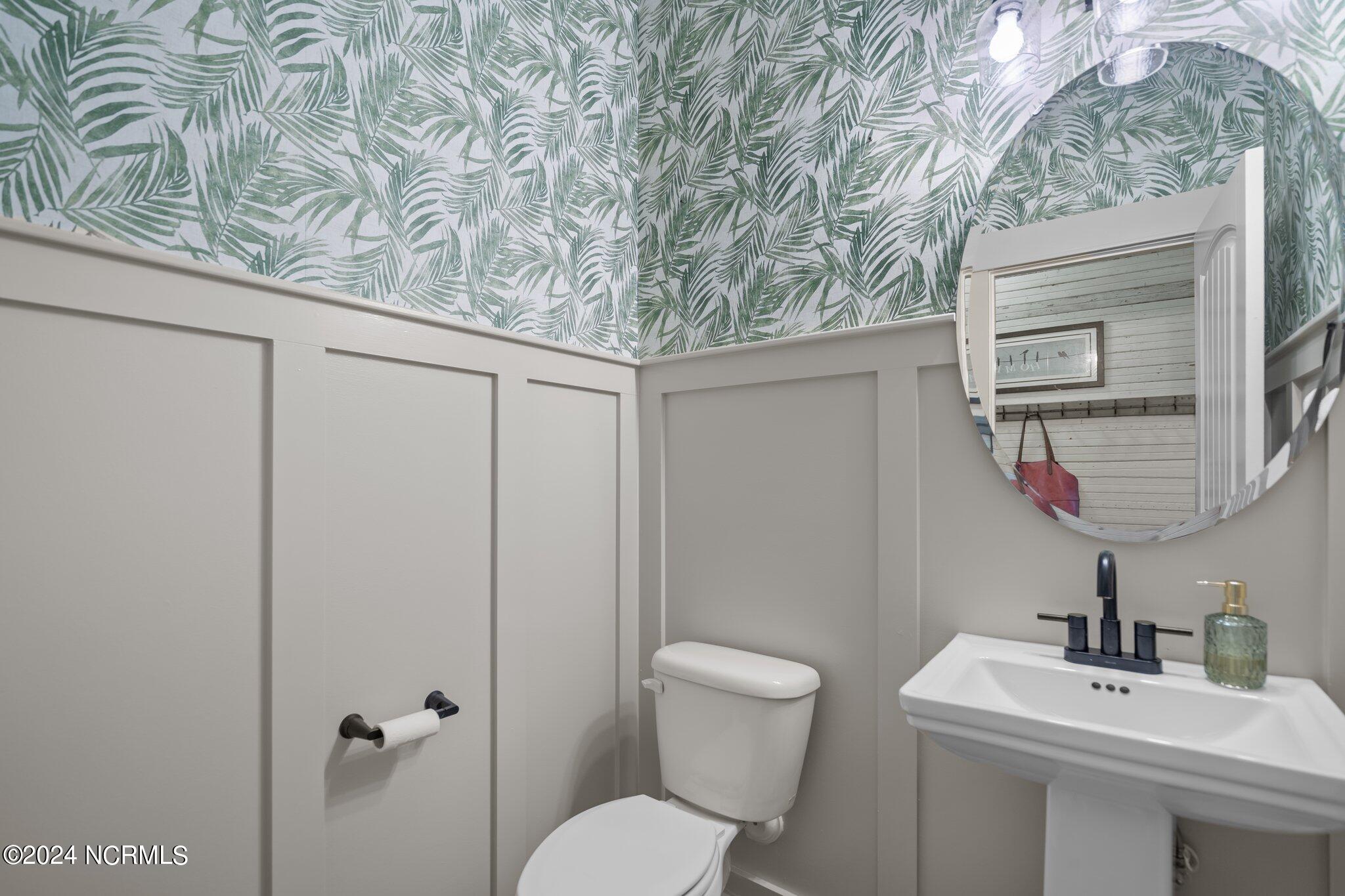 1509 Spring Court Leland, NC 28451 - Photo 19 of 35 Powder room with custom wall accents