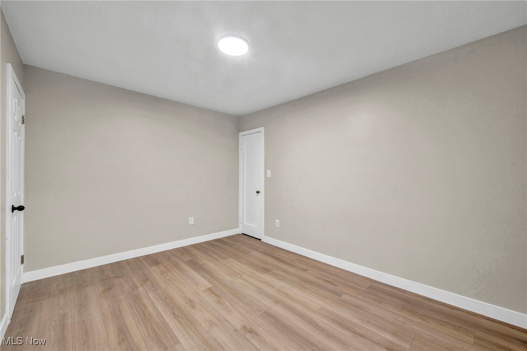 614 Weller Road Elyria, OH 44035 - Photo 31 of 39 Empty room with light wood-type flooring and baseboards