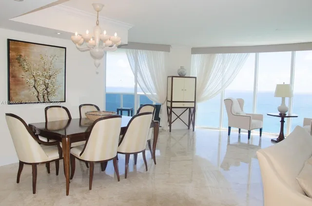 a view of a dining room with furniture window and outside view