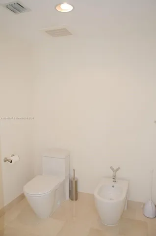 a bathroom with a granite countertop sink a mirror and a shower