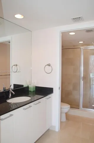 a bedroom with a bed and a table