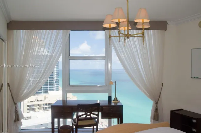 a view of room with furniture and wooden floor