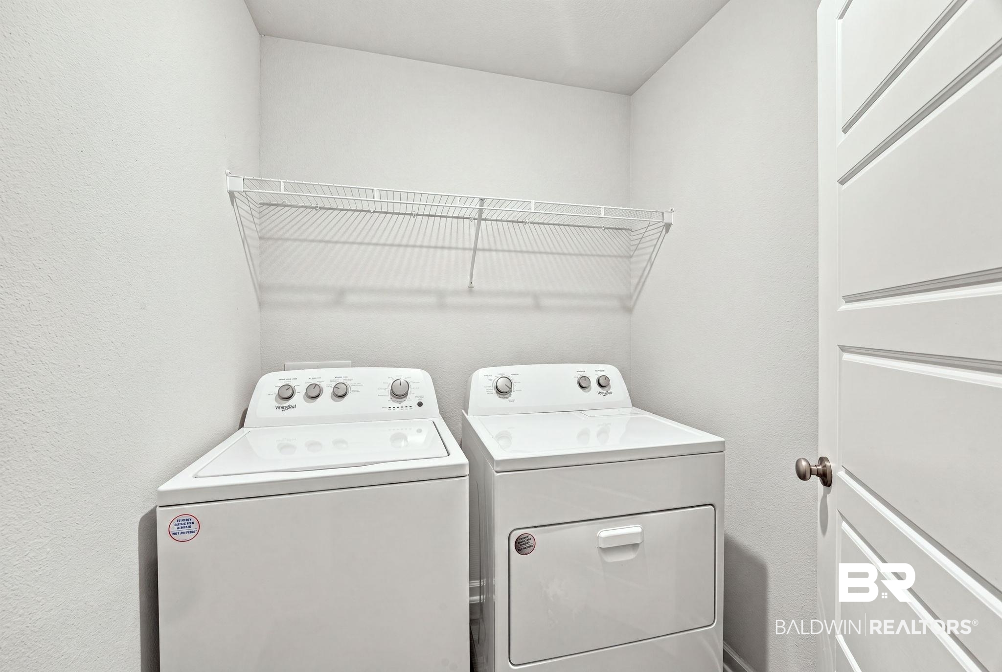 32155 Terranova Loop Lillian, AL 36549 - Photo 28 of 37 Dedicated laundry area featuring a top-load washer and front-load dryer