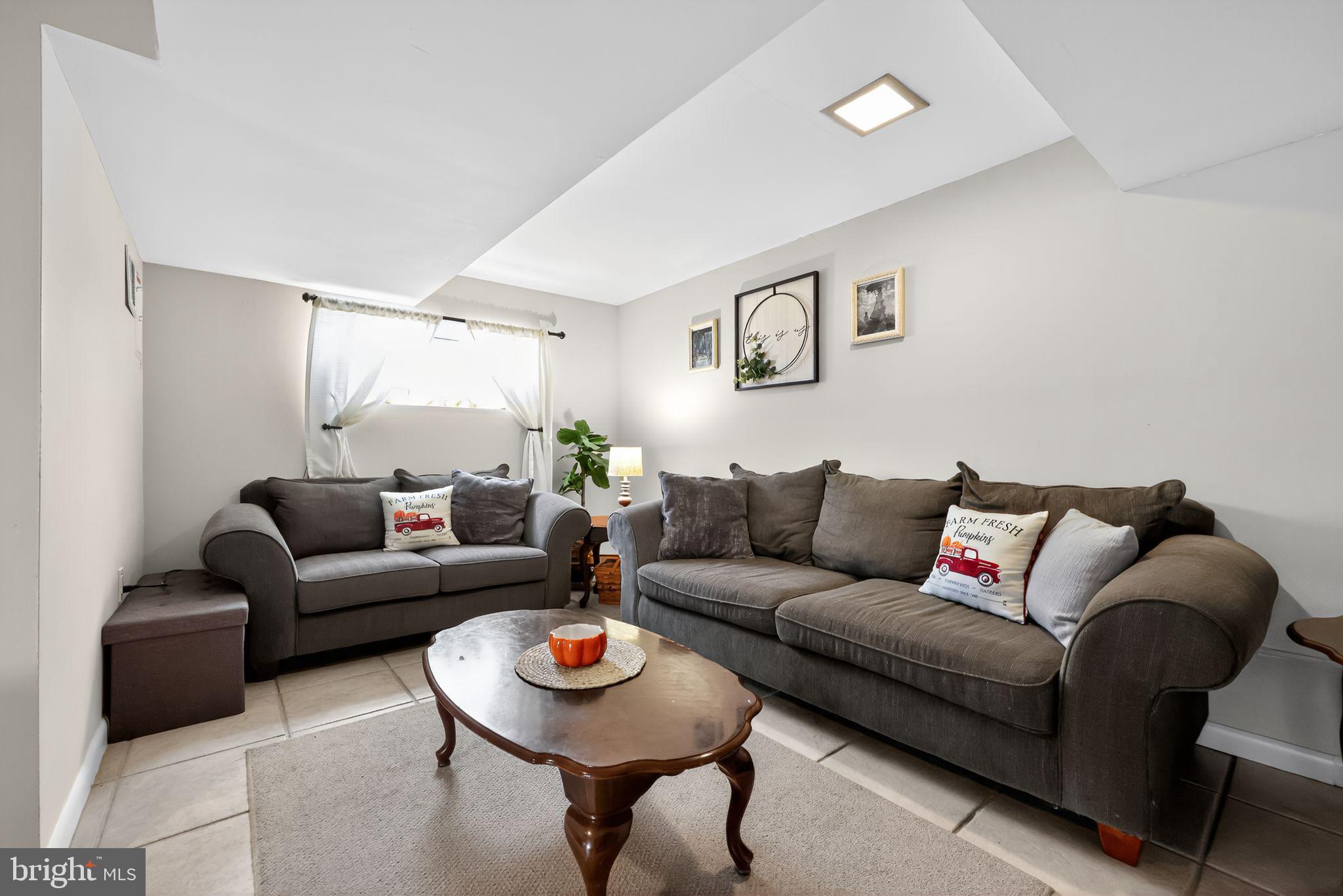 33 Beach Avenue Pennsville, NJ 08070 - Photo 14 of 32 a living room with furniture and a wooden floor