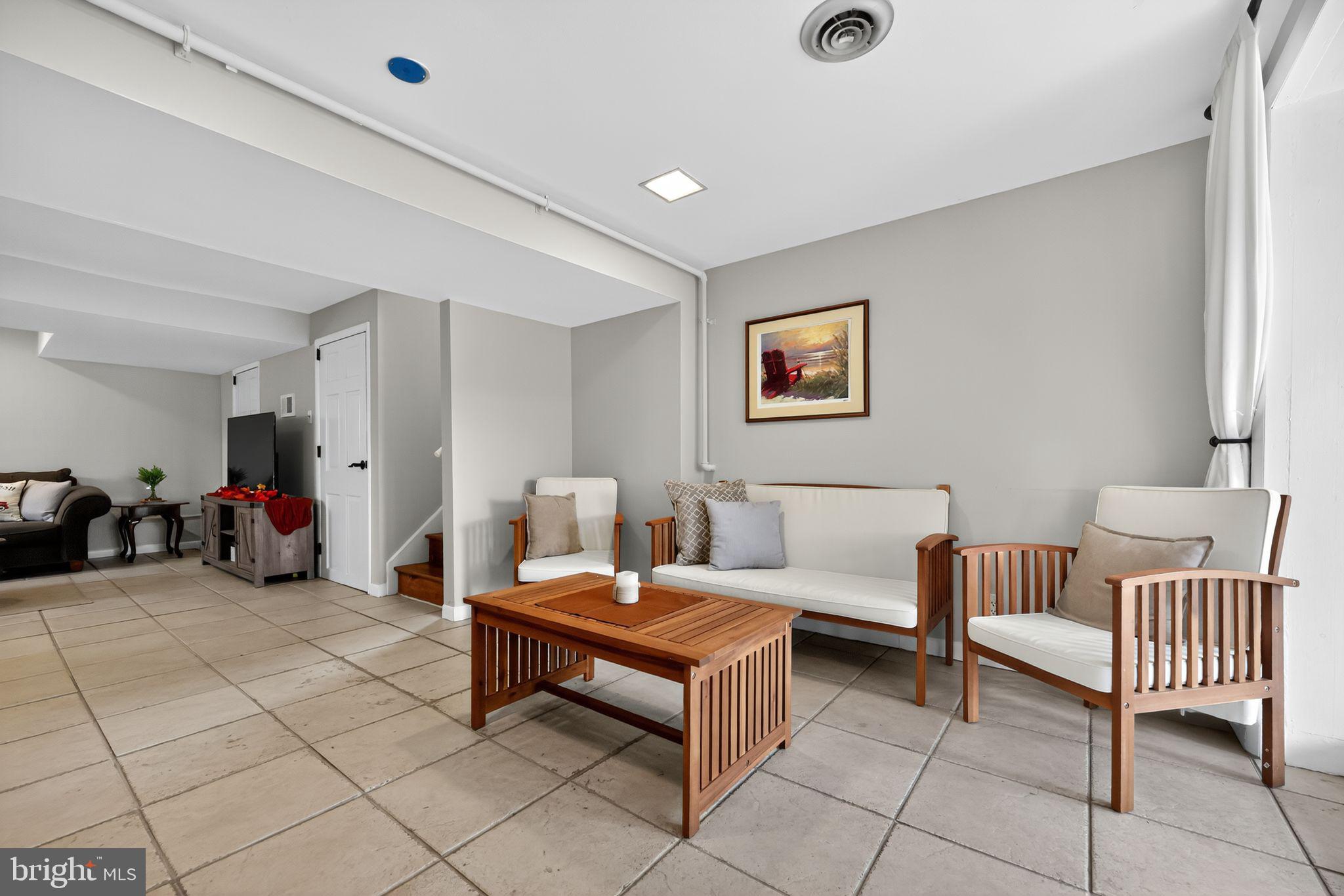33 Beach Avenue Pennsville, NJ 08070 - Photo 17 of 32 a living room with furniture and a dining table