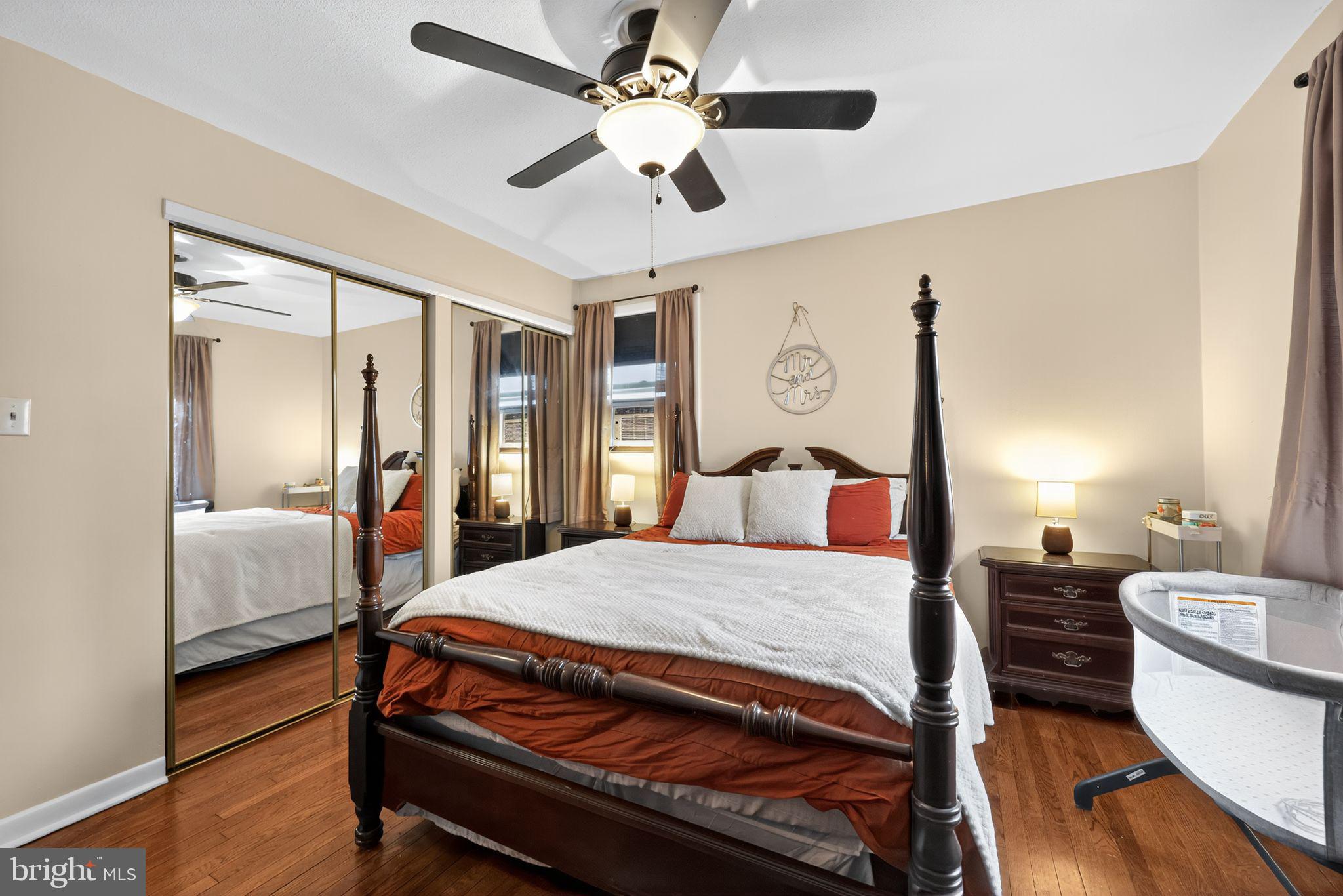 33 Beach Avenue Pennsville, NJ 08070 - Photo 25 of 32 a bedroom with a large bed and a chandelier