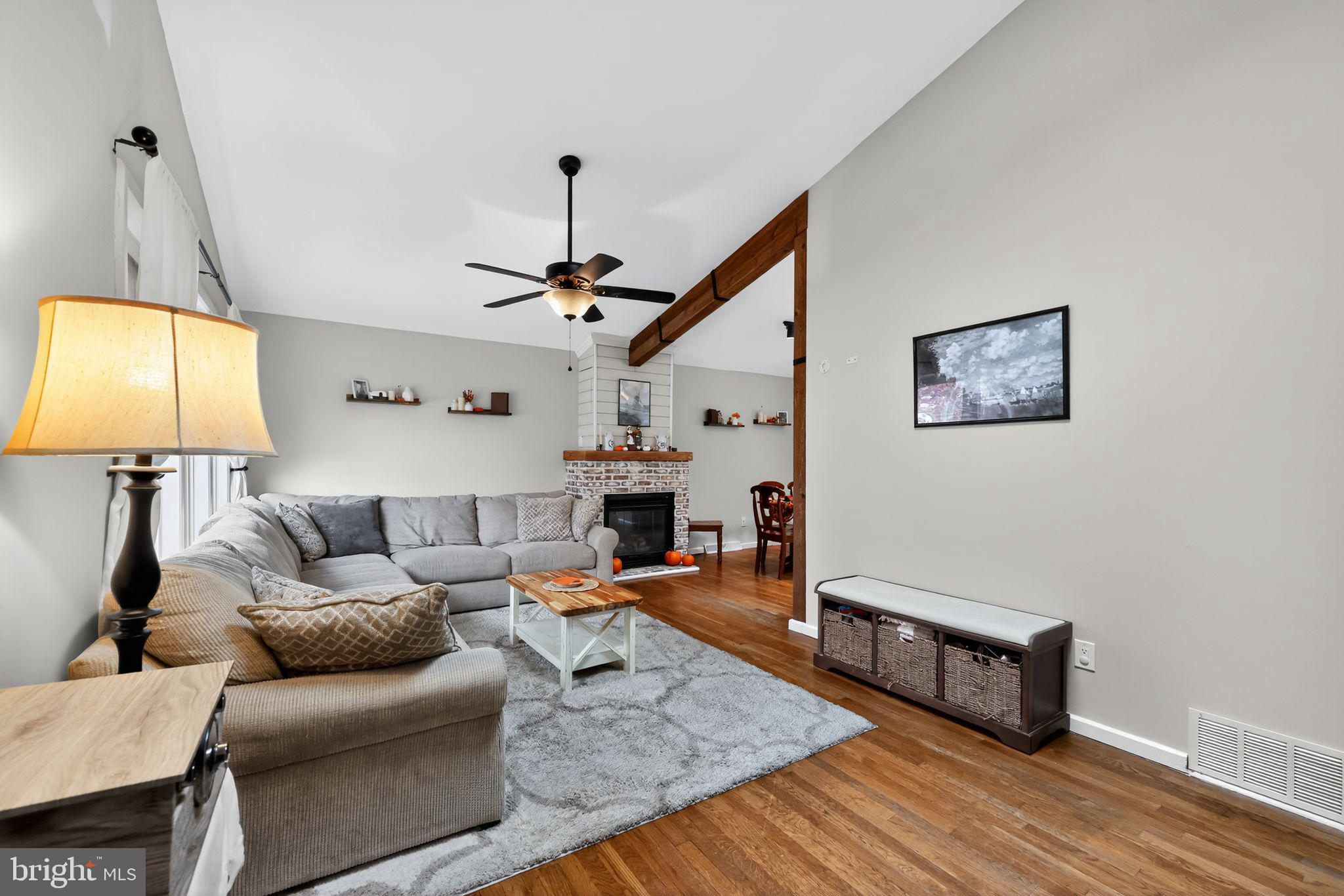 33 Beach Avenue Pennsville, NJ 08070 - Photo 6 of 32 a living room with furniture and a lamp