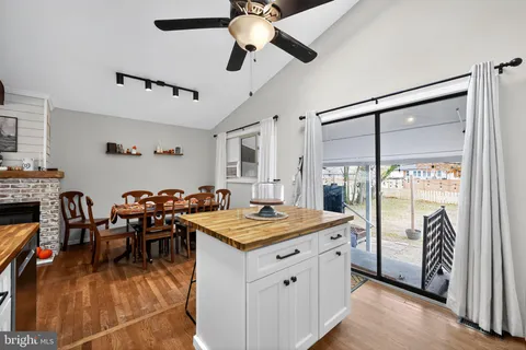 a kitchen with stainless steel appliances granite countertop a stove refrigerator sink and cabinets