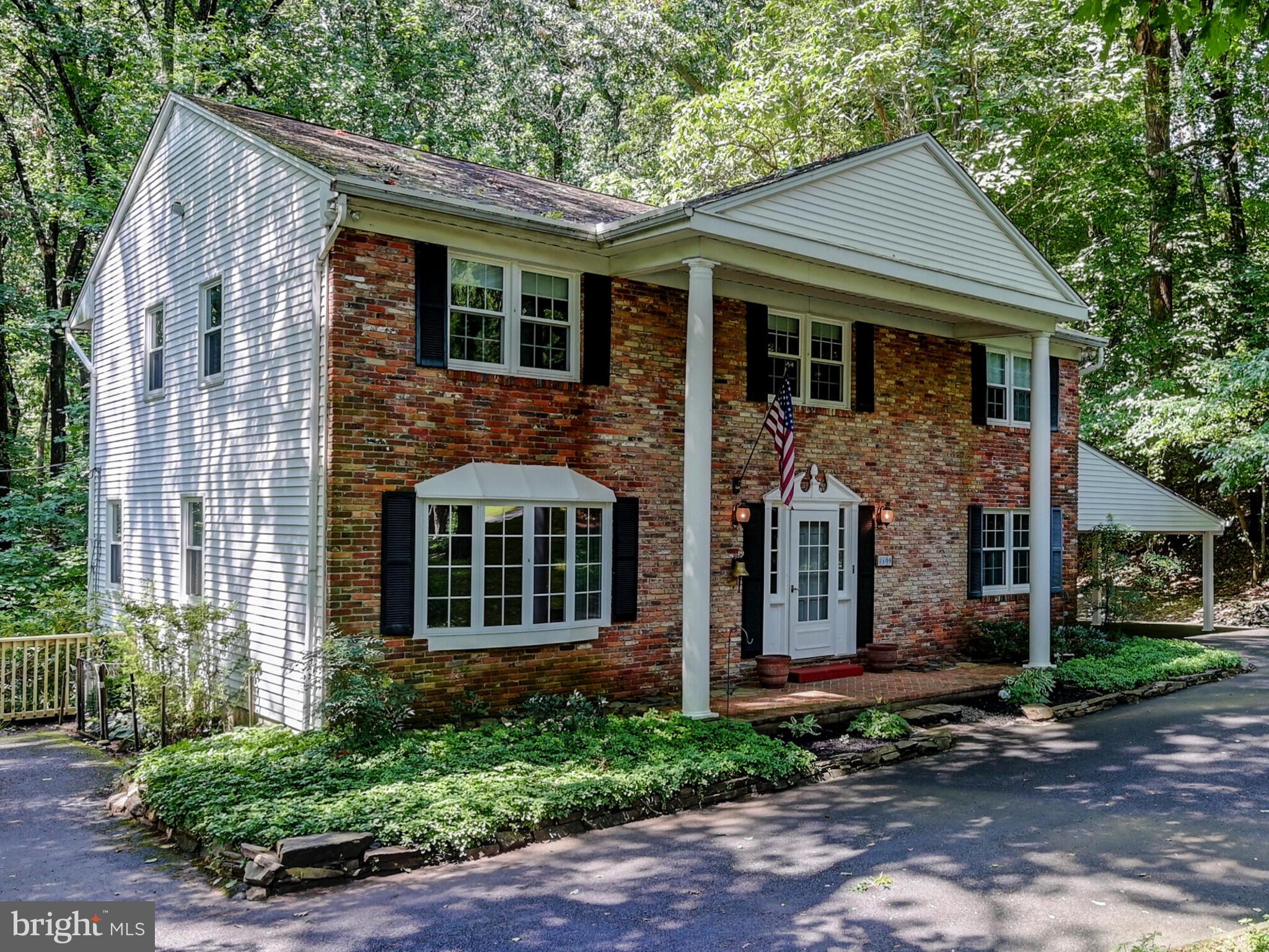 1109 High Country Road Baltimore, MD 21286 - Photo 3 of 43 a front view of a house with garden