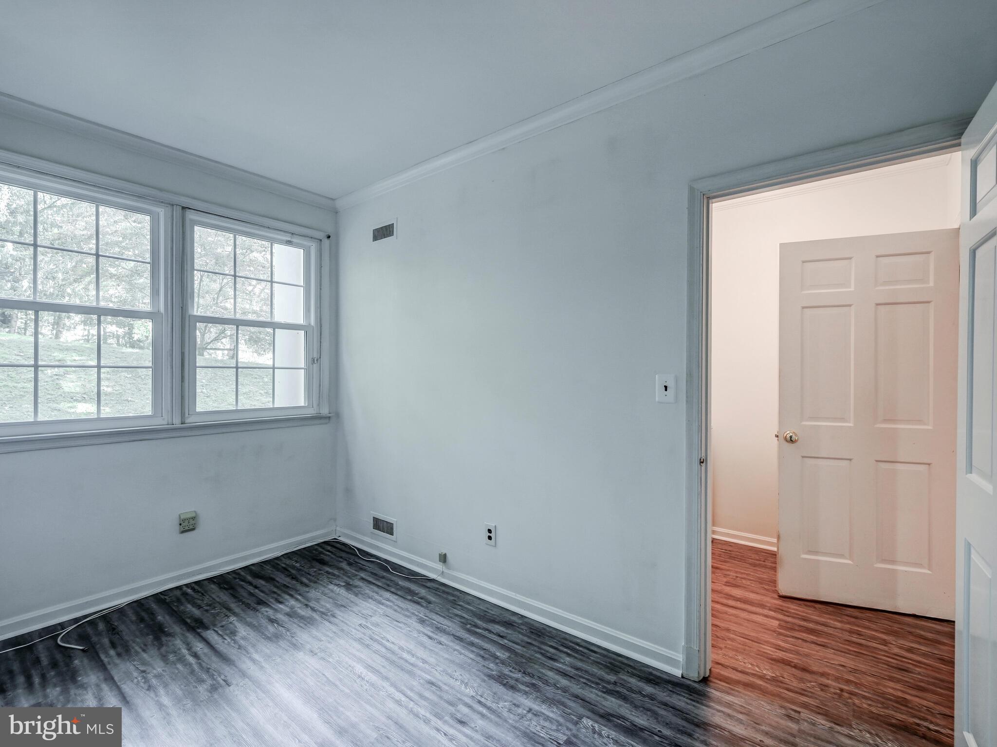 1109 High Country Road Baltimore, MD 21286 - Photo 22 of 43 a view of a room with wooden floor and window
