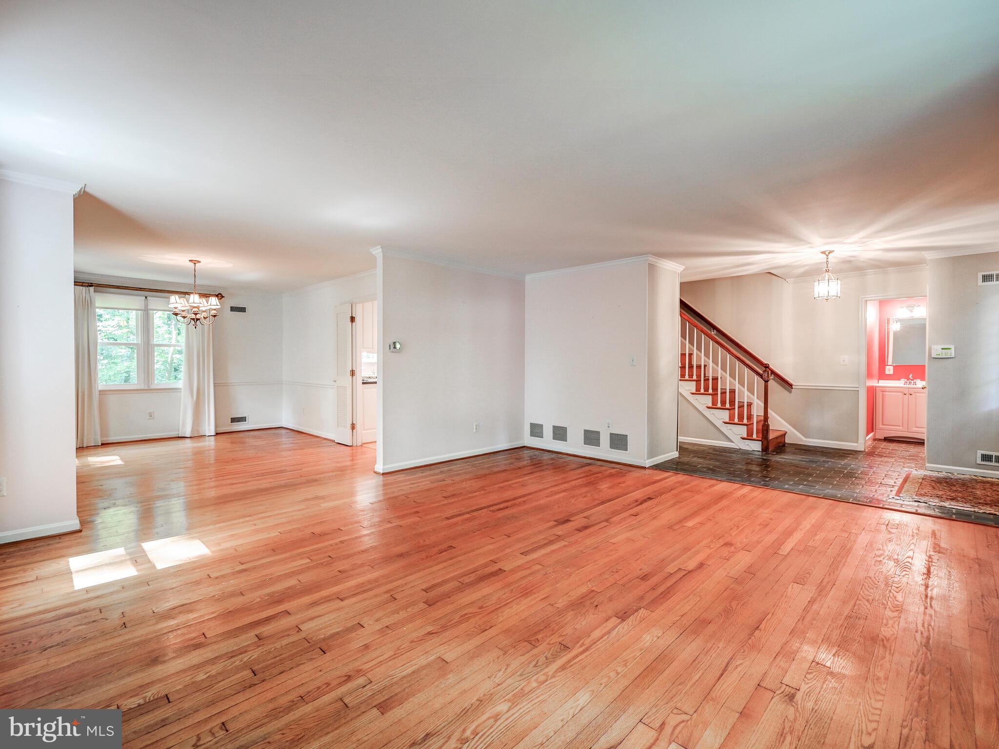 1109 High Country Road Baltimore, MD 21286 - Photo 40 of 43 a view of an empty room with wooden floor and a window
