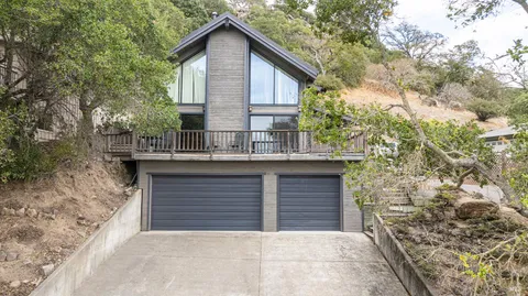 a front view of a house with garage