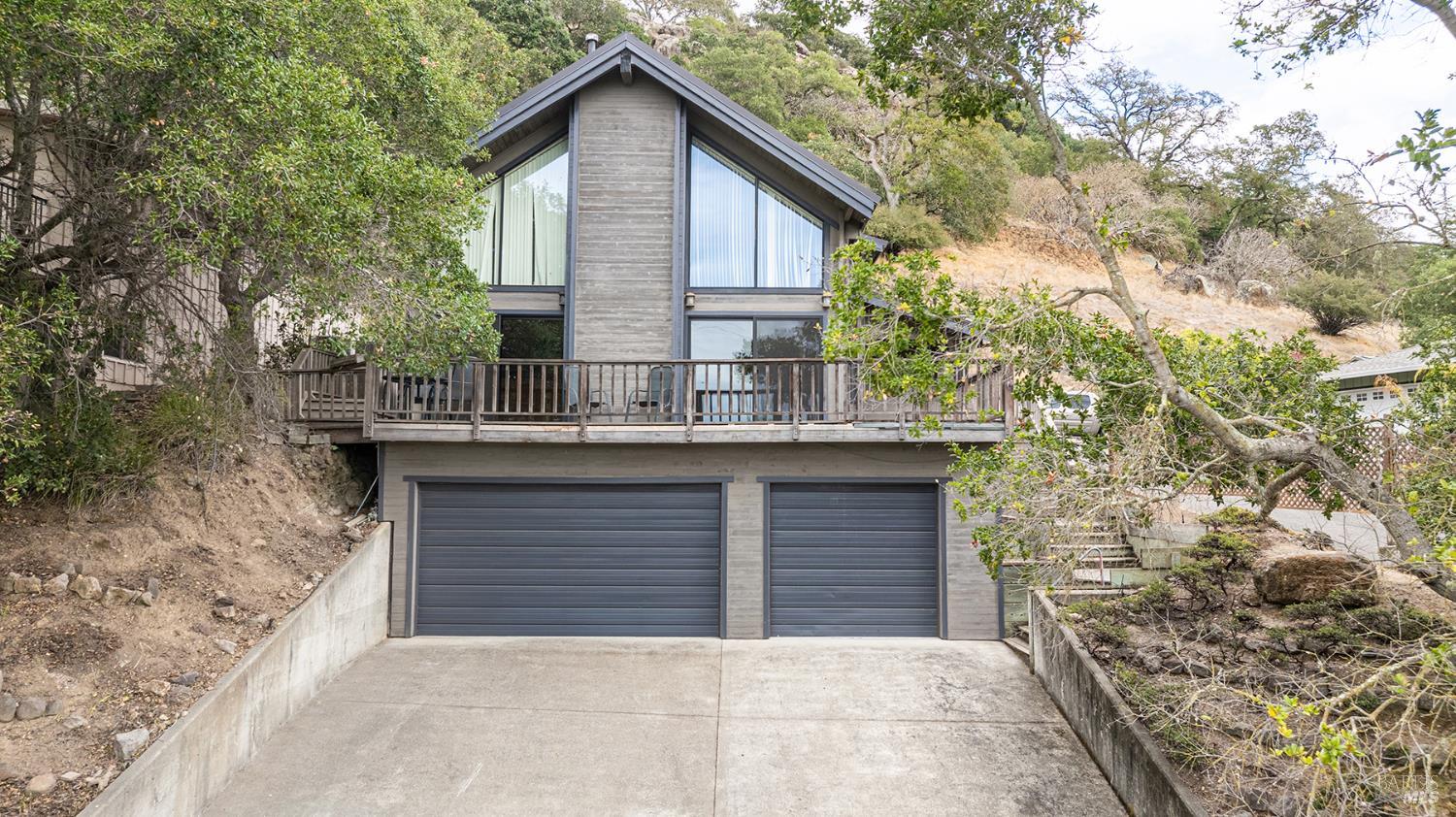 a front view of a house with garage