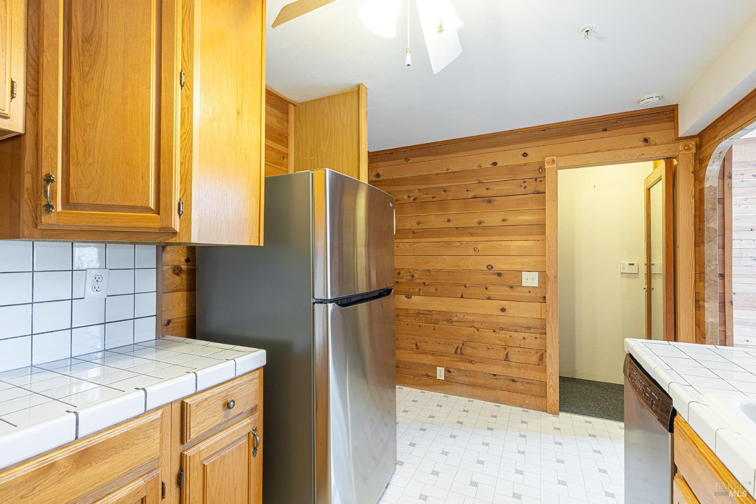 1450 Sproul Avenue Napa, CA 94559 - Photo 12 of 43 a kitchen with a refrigerator and a sink