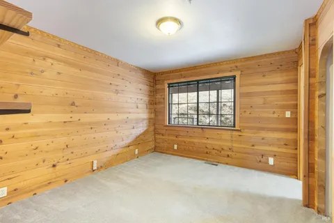 a view of an empty room and a window