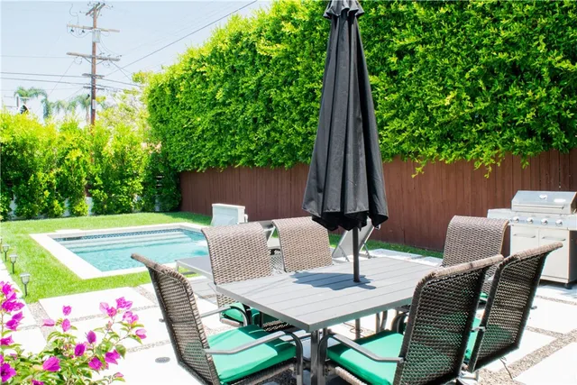 a view of a tables and chairs in patio