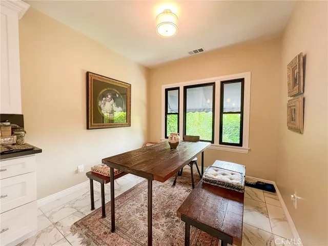 a view of a living room kitchen and a wooden floor