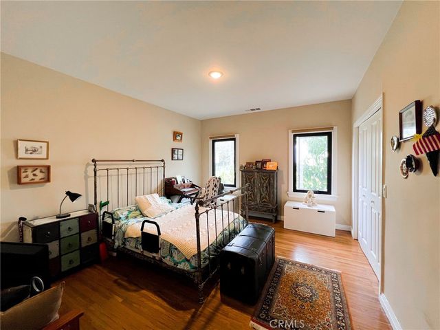 a bedroom with a bed and a couch