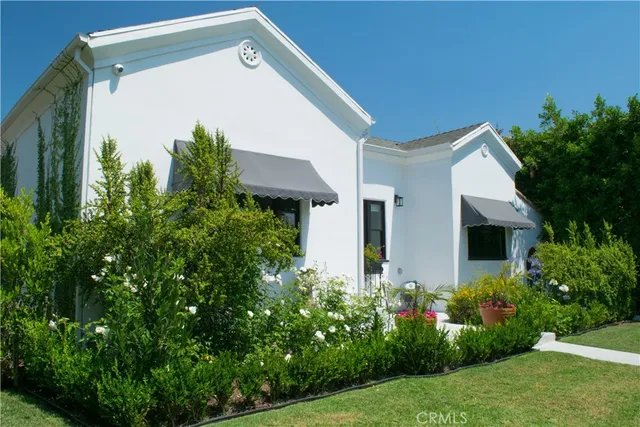 a front view of house with garden
