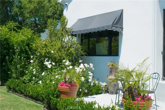 a outdoor living space with furniture and a potted plant